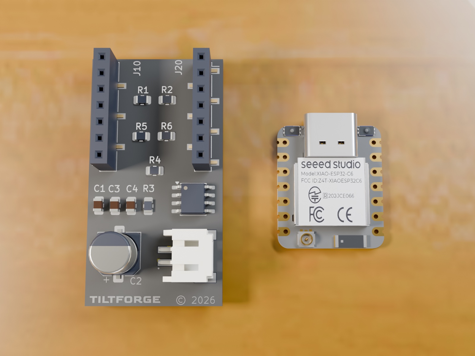Rev D control board and Seeed XIAO ESP32-C6 module side by side, top-down